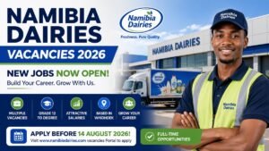 A Namibia Dairies employee standing outside the company's Windhoek production facility with a branded delivery truck, highlighting Namibia Dairies Vacancies 2026 for driver, logistics, production, and merchandiser positions.